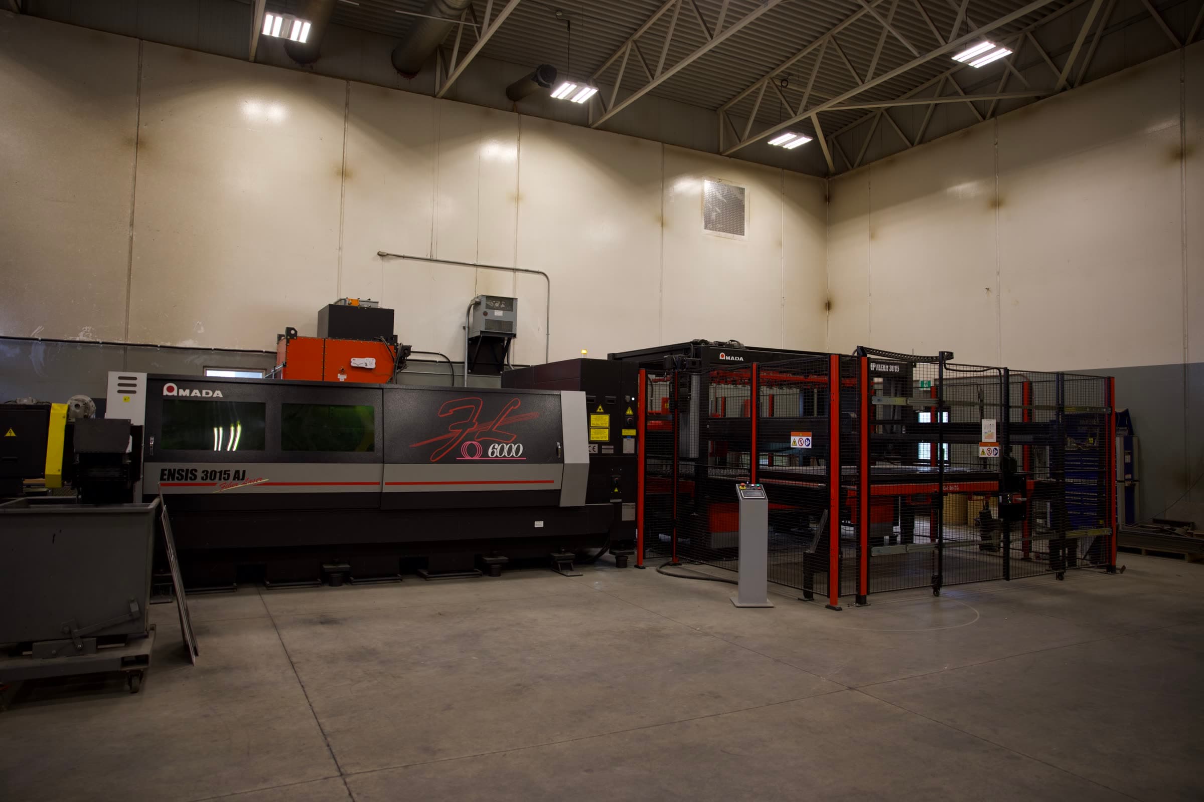 AMADA ENSIS 3015 AJ fiber laser with automated material-handling tower on Ridgeland's shop floor